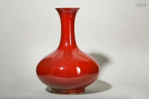 A CHINESE COPPER RED-GLAZED BOTTLE VASE.