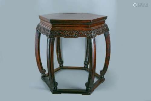 A CHINESE HEXAGONAL CARVED WOOD STAND.