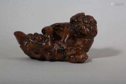 A CHINESE ROOT WOOD 'LION AND CUB' CARVING.