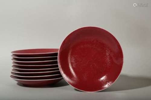 A SET OF NINE CHINESE COPPER RED GLAZE DISHES.