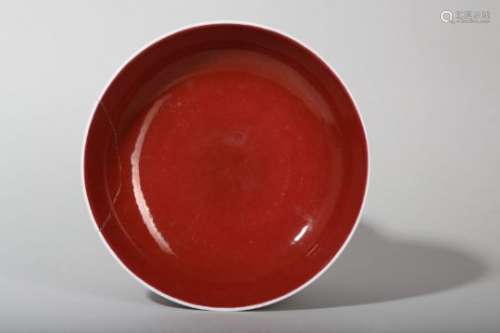 A CHINESE COPPER RED GLAZED DISH.