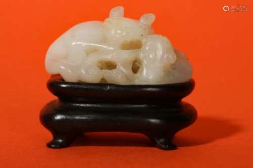 A CHINESE WHITE JADE 'CAT' GROUP.