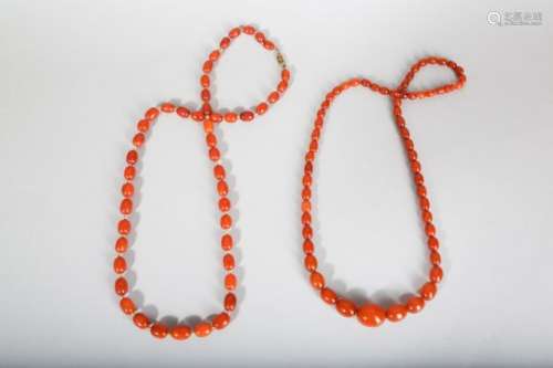 TWO AMBER BEAD NECKLACES.