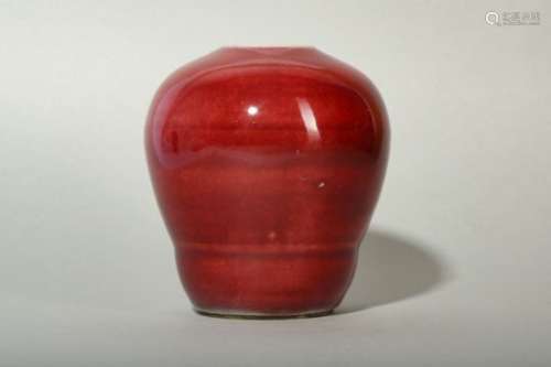 A CHINESE COPPER RED-GLAZED JAR.