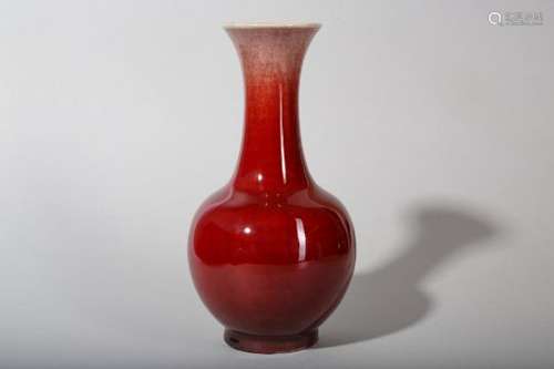 A CHINESE COPPER RED-GLAZED BOTTLE VASE.