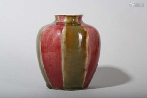 A CHINESE COPPER RED AND OLIVE GREEN-GLAZED JAR.