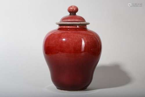 A CHINESE COPPER RED-GLAZED JAR AND COVER.