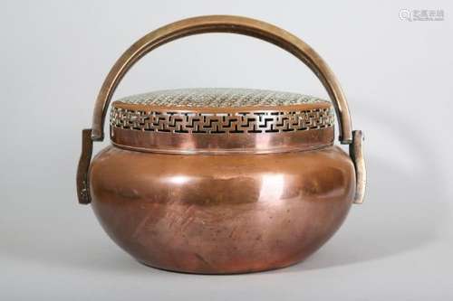 A LARGE CHINESE COPPER ALLOY HANDWARMER AND COVER.