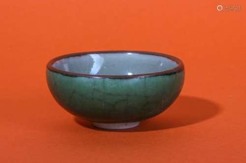 A CHINESE GREEN-GLAZED BOWL.