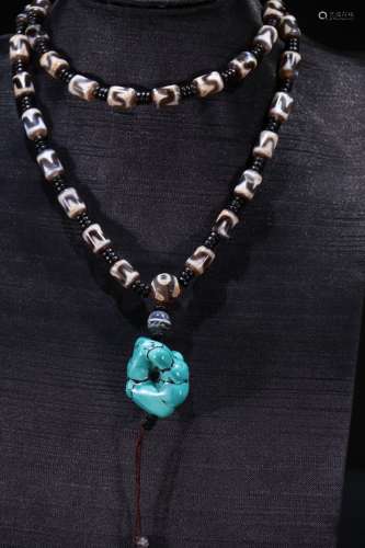 A Tibetan Dzi Necklace With Turquoise Stone