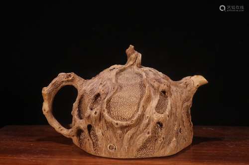 A Chinese Zisha Teapot Of Burl Carving