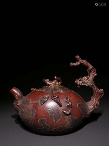 A Chinese Zisha Teapot Of Grape Pattern