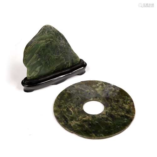 Spinach jade bi disc Chinese of archaic form, 15cm and a hardstone scholars piece in the form of a