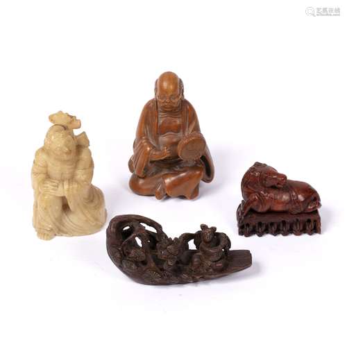 Group of four carvings Chinese, 19th Century and later to include a bamboo carving of a priest