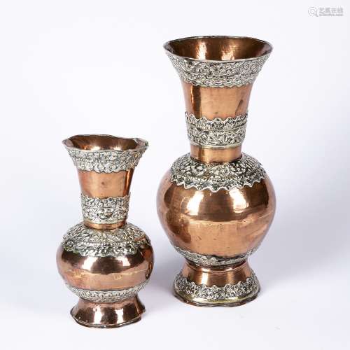 Two copper vases Persian with applied white metal mounts in foliate splays 26cm, 17cm high (2)