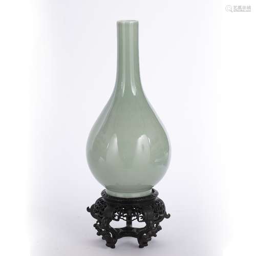 Monochrome bottle vase Chinese, 19th Century of celadon colour, the ovoid body tapering towards