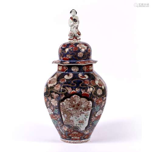 Imari vase and cover Japanese, 18th Century finial in the form of a figure holding a fan and with