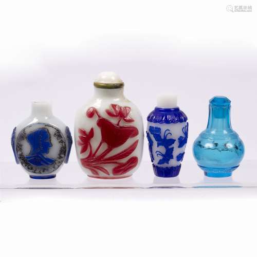 Four glass snuff bottles Chinese, 19th/20th Century comprising a red overlay decorated snuff