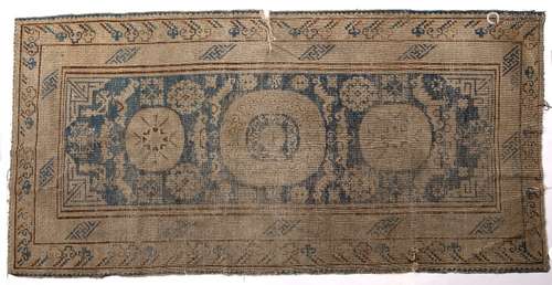 Khotan rug Chinese blue ground with central medallions, 261cm x 126cm