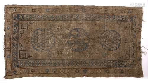 Khotan rug Chinese with three central roundels, 239cm x 122cm