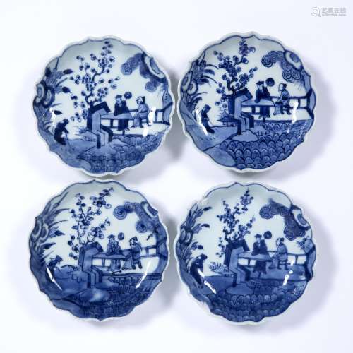Four blue and white scallop edge dishes Chinese, 18th/19th Century decorated to the centre with