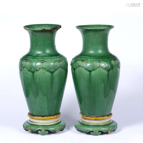 Pair of green glazed vases and stands Chinese, 18th/19th Century decorated to the neck with a ruyi