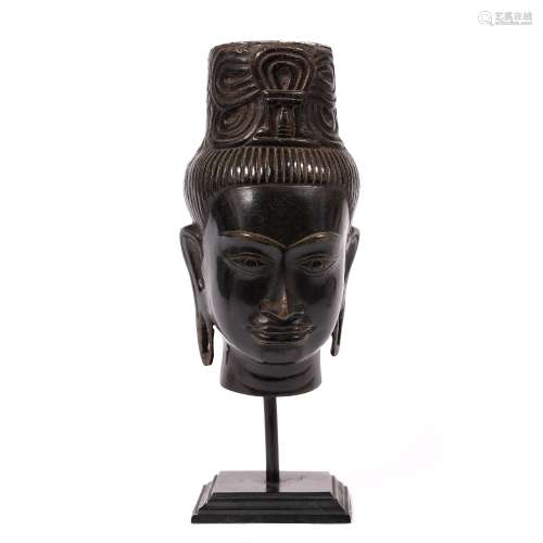 Bronze head of a deity Tibetan, 19th/20th Century on a later metal stand, head 24.5cm, overall