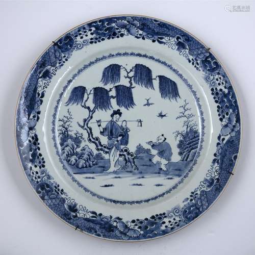 Large blue and white porcelain charger Chinese, 19th Century painted with two figures in a garden