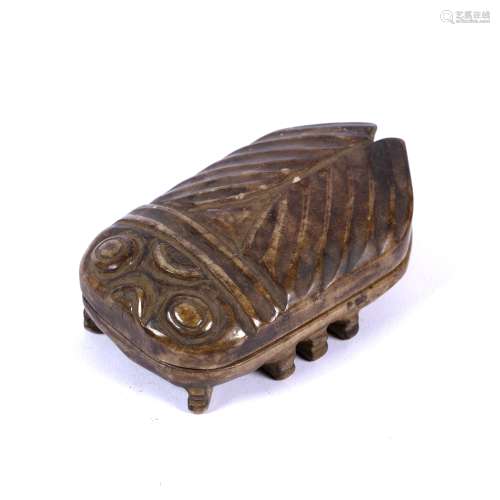 Brown jade box Chinese Chou style, carved as a stylised cicada, wings and feet in relief, 10cm x 6cm