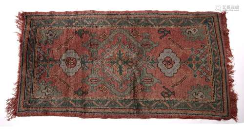 Ushak red ground rug Turkish with central medallion and foliate designs, 170cm x 92cm