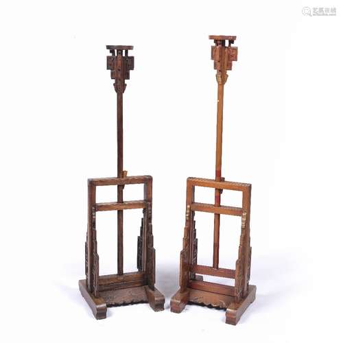 Pair of full height candle stands Chinese with adjustable columns , each on a carved base, .from