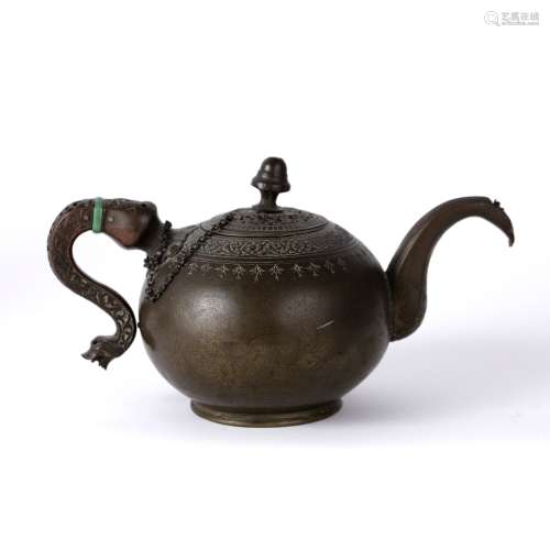 Islamic bronze teapot 19th Century of rounded form, engraved with a band of Koranic verse and