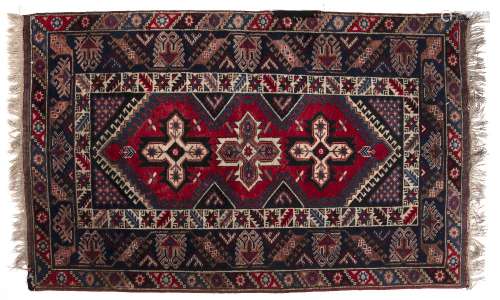 Doshmelolta rug Turkish with three central star motifs within a triple foliate and geometric border,