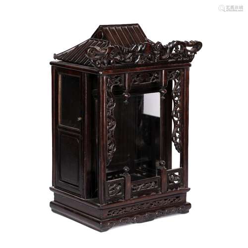 Carved wooden altar cabinet Chinese with pierced decorated sides and a slated rood, with glass front