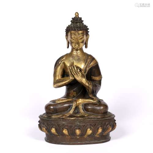 Seated Buddha Shakyamuni Nepalese, 19th Century partially gilded bronze with hands in wheel