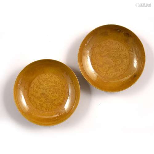 Yellow glazed saucer dishes Chinese, Kangxi period decorated with plain rounded sides within which