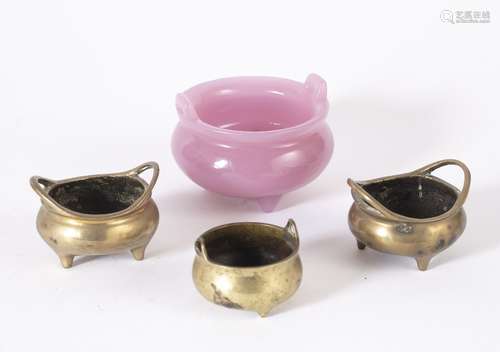 Pink glass censer Chinese supported by three squat feet, the base with a six character mark, 8.5cm