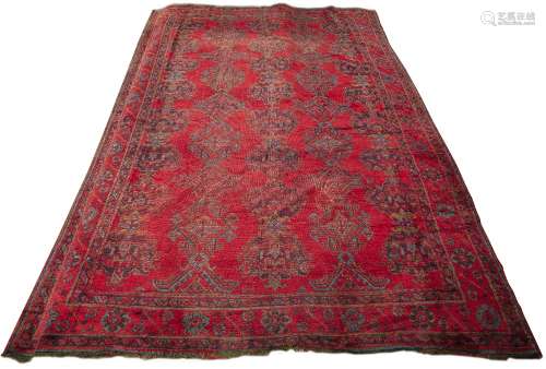 Large red ground Ushak carpet Turkish with traditional rows of geometric designs in blues and