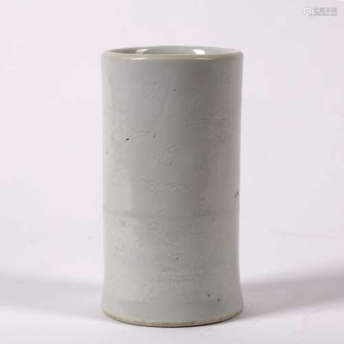 White glazed brush pot Chinese, 18th Century the cylindrical pot with delicate incised clouds,