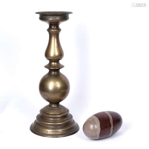 Tall brass candlestick Indian, 19th Century 51cm high and a Shiva Lingam stone stand (from the