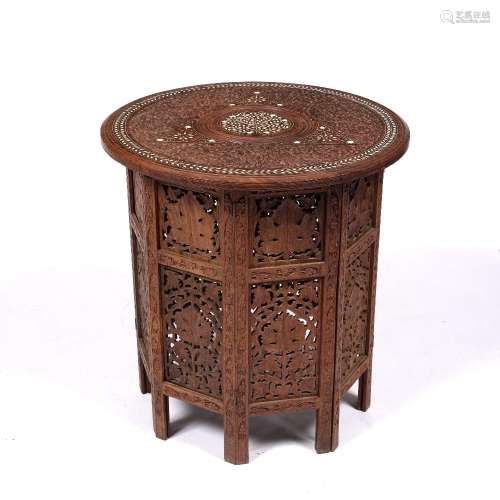 Circular ivory inlaid folding table Indian with foliate designs, 52cm across