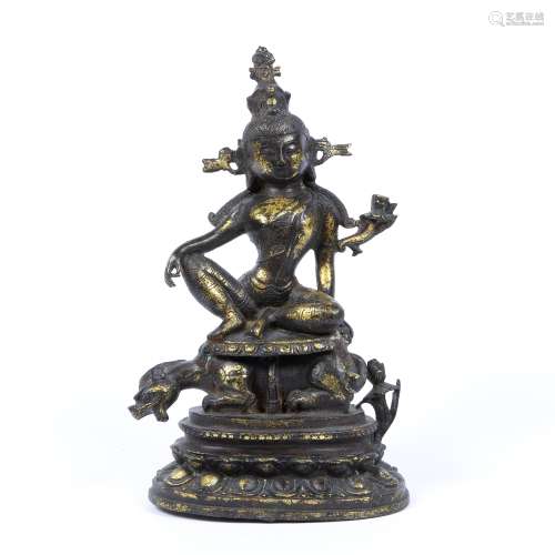 Cast gilt bronze statue of Avalokiteshvara Sino-Tibetan, 19th Century astride a feline ('lion') on a