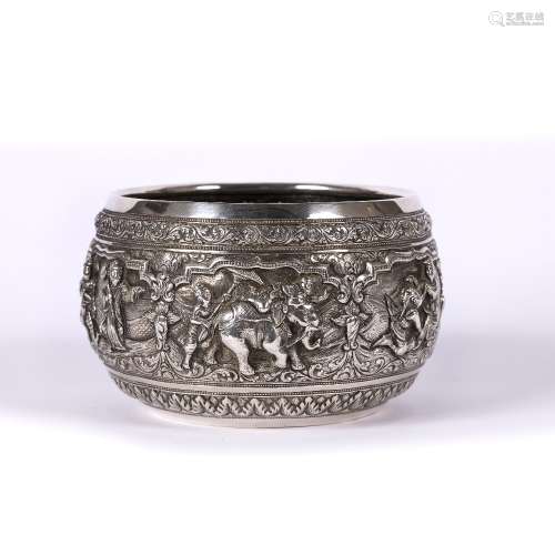 White metal Thabeik bowl Burmese, embossed with panels of various figures within foliate banded
