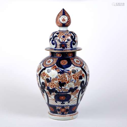 Imari vase and cover Japanese decorated with panels of birds, the lid with an elongated finial, 45cm