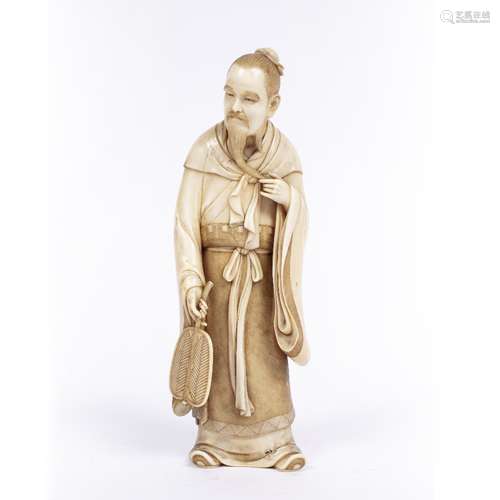 Ivory standing figure of a Daoist Immortal Japanese, Taisho (1912-1926) holding an Uchiwa fan in his