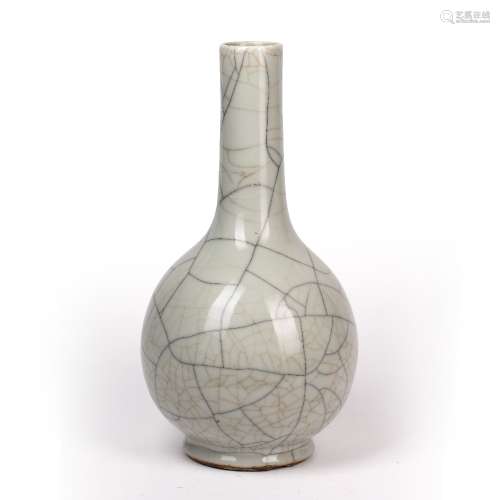 Guan type bottle vase Chinese, 19th Century covered in a pale glaze, with a fluted neck, 37.5cm
