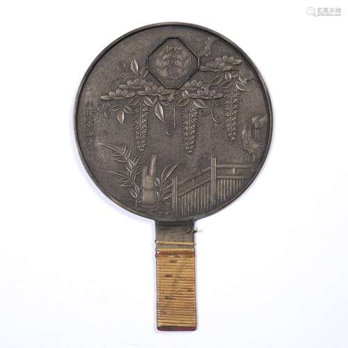 Bronze hand mirror Japanese, Meiji period with bamboo, fence and trailing foliage, inscribed, 28cm x