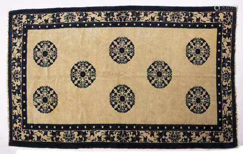 Peking rug Chinese circa 1920 with eight blue roundels on an ivory ground, 212cm x 129cm