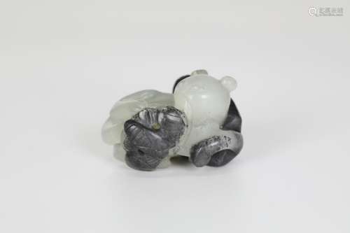 In the 19th century, Hetian jade carved with two beasts in black and white