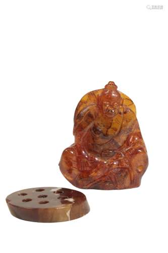 CARVED AMBER FIGURE OF SEATED BUDDHA, QING DYNASTY